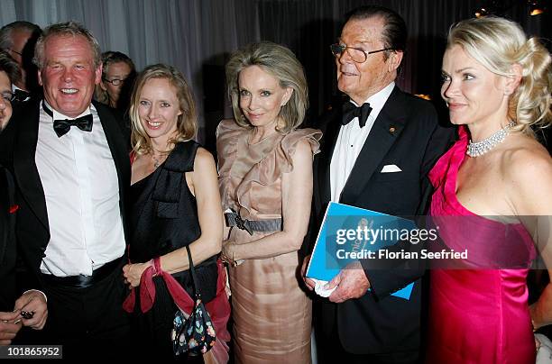 Actor Nick Nolte, Clytie Lane, actor Roger Moore and partner Kiki Tholstrup and her daughter Christina Knudsen attend An Evening For Africa at the...