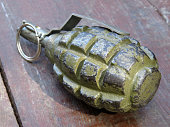 Soviet and russian hand grenade F-1 on wooden table