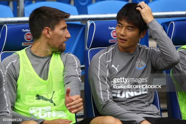 Newcastle United's substitutes Newcastle United's Argentinian defender Federico Fernandez and Newcastle United's South Korean midfielder Ki...