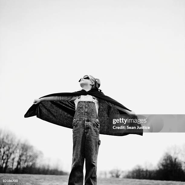 girl in superhero cape - pretending to be a plane stock pictures, royalty-free photos & images