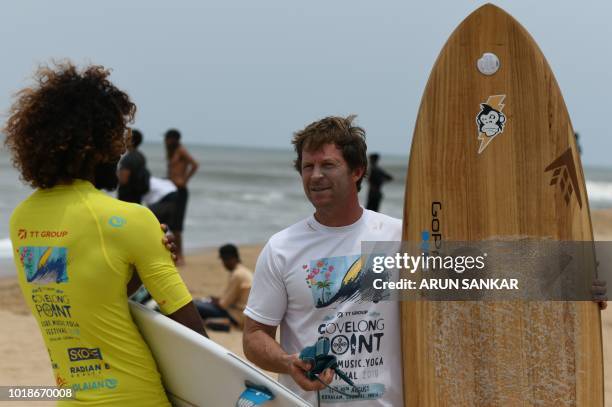 Former South African cricketer Jonty Rhodes gestures during the annual Covelong Point Classic Surf festival at Kovalam on the outskirts of Chennai on...