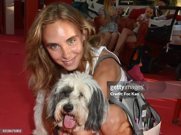 Actress Mathilde Laffont and her thibetan dog Talung attend the "Trophee Senequier 2018" at Place des Lices Saint-Tropez On French Riviera on August...