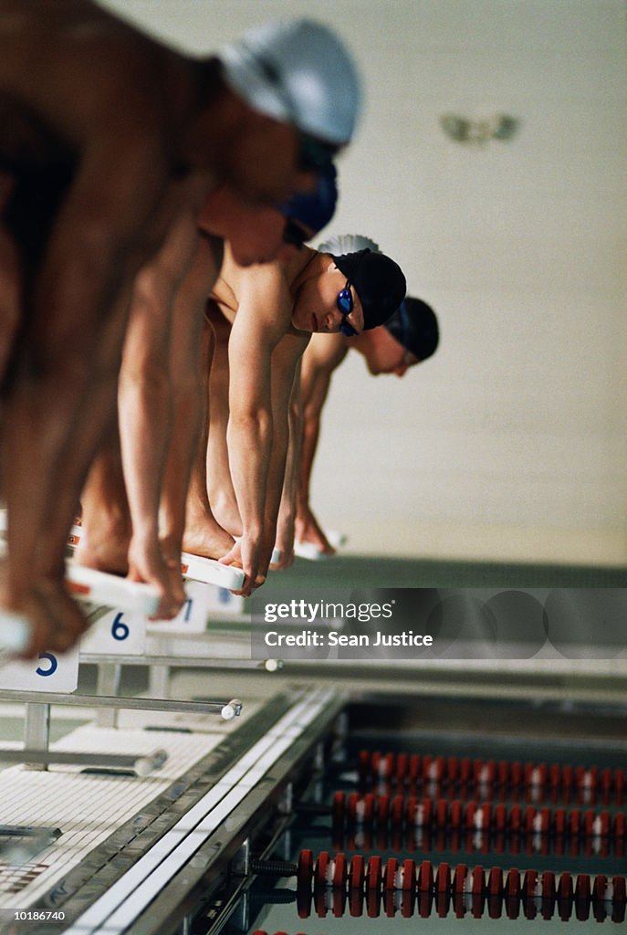 SWIMMERS ON RACING BLOCK GETTING READY