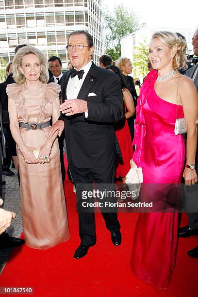 Actor Roger Moore and partner Kiki Tholstrup and her daughter Christina Knudsen attend An Evening For Africa at the Burda Medien Park on June 7, 2010...