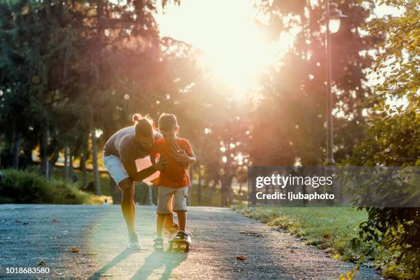 cruising down the road home - father sun stock pictures, royalty-free photos & images