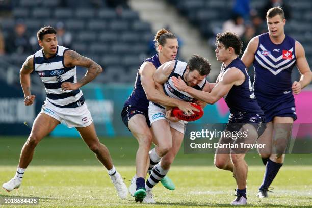 Nat Fyfe of the Dockers tackles Patrick Dangerfield of the Cats during the round 22 AFL match between the Geelong Cats and the Fremantle Dockers at...