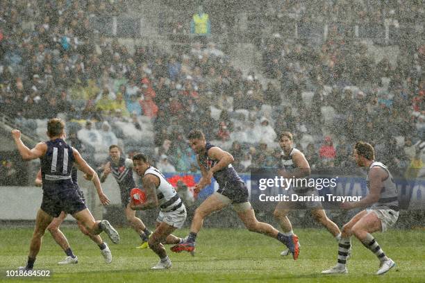 General view as a hailstorm stikes during the round 22 AFL match between the Geelong Cats and the Fremantle Dockers at GMHBA Stadium on August 18,...