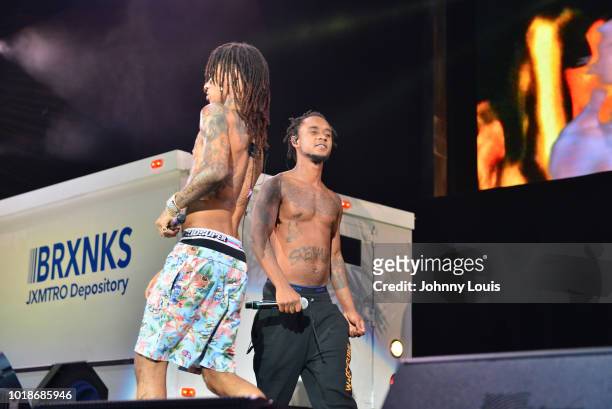 Slim Jxmmi and BoBo Swae Lee of Rae Sremmurd perform on stage at Perfect Vodka Amphitheatre on August 17, 2018 in West Palm Beach, Florida.