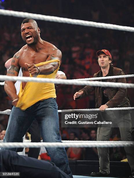 Quinton 'Rampage' Jackson and Sharlto Copley attend WWE Monday Night Raw at American Airlines Arena on June 7, 2010 in Miami, Florida.