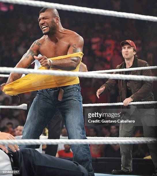 Quinton 'Rampage' Jackson and Sharlto Copley attend WWE Monday Night Raw at American Airlines Arena on June 7, 2010 in Miami, Florida.