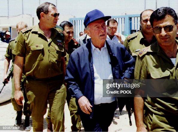 Israeli Prime Minister Yitzhak Rabin is surrounded by Israeli army ...