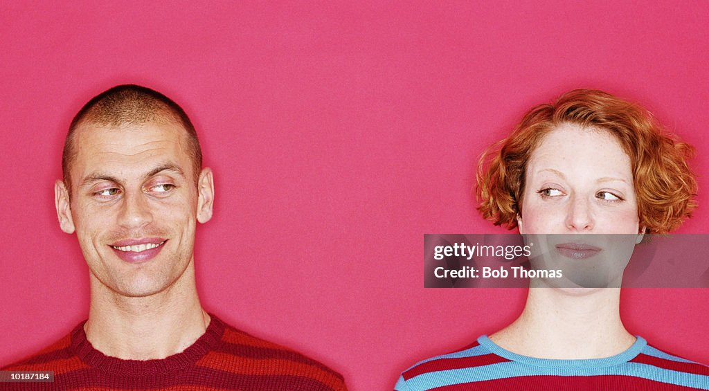 COUPLE GLANCING AT EACH OTHER, CLOSE-UP