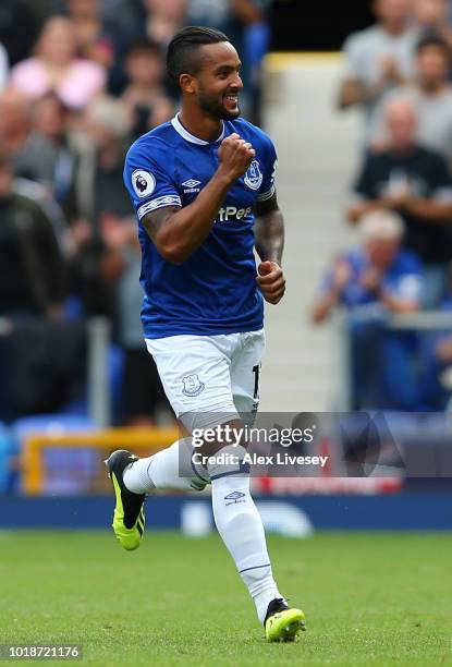 Theo Walcott of Everton celebrates scoring his team's first goal during the Premier League match between Everton FC and Southampton FC at Goodison...