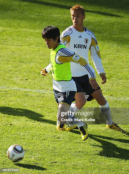 Shinji Kagawa evades Keisuke Honda during a Japan training session at Outeniqua Stadium on June 8, 2010 in George, South Africa.