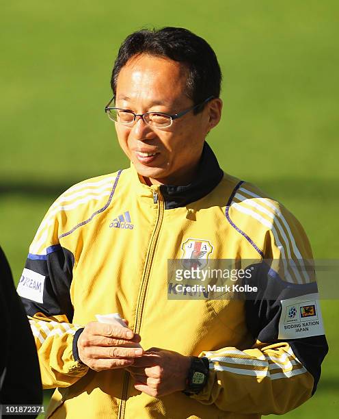 Japan coach Takeshi Okada smiles as he watches on during a Japan training session at Outeniqua Stadium on June 8, 2010 in George, South Africa.