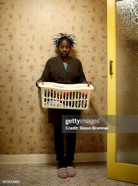 woman with wash basket - curlers stock pictures, royalty-free photos & images