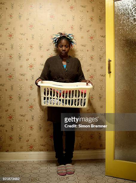 woman with wash basket - laundry basket imagens e fotografias de stock