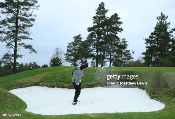 Thomas Aiken of South Africa plays his 2nd shot out of a bunker on the 15th hole during day three of the Nordea Masters at Hills Golf Club on August...