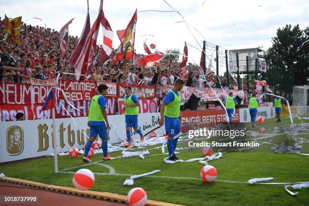 Fans of Muenchen throw paper and balls onto the pitch during the DFB Cup first round match between SV Drochtersen-Assel and Bayern Muenchen on August...