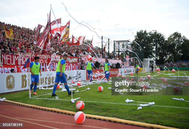 Fans of Muenchen throw paper and balls onto the pitch during the DFB Cup first round match between SV Drochtersen-Assel and Bayern Muenchen on August...