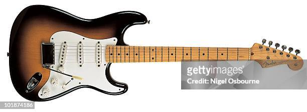 Studio still life of a 1957 Fender Stratocaster guitar, photographed in the United Kingdom.