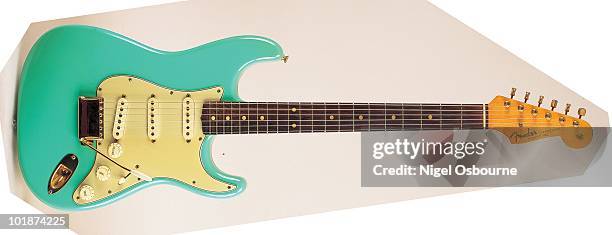 Studio still life of a 1962 Fender Stratocaster guitar, photographed in the United Kingdom.