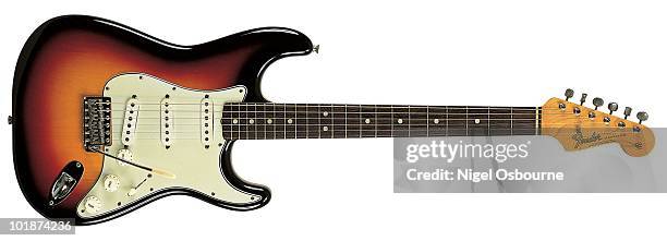 Studio still life of a 1964 Fender Stratocaster guitar, photographed in the United Kingdom.