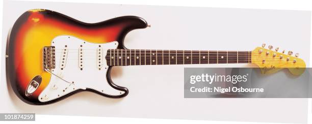 Studio still life of a 1966 Fender Stratocaster guitar, photographed in the United Kingdom.