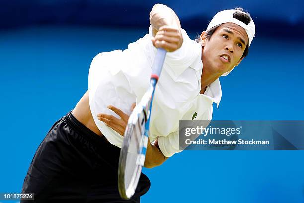 Somdev Devvarman of India serves during his first round match against Mardy Fish of USA on Day 2 of the the AEGON Championships at Queen's Club on...