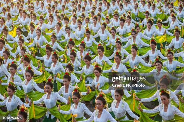 Young women perform the colossal dance Rejang Sandat Ratu Segara at Tanah Lot 2018 Festival on August 18, 2018 in Tabanan, Bali, Indonesia.