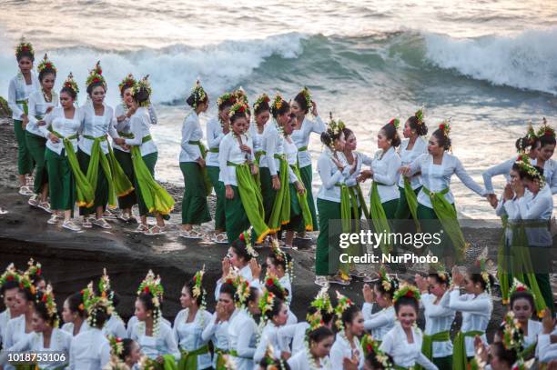 Young women perform the colossal dance Rejang Sandat Ratu Segara at Tanah Lot 2018 Festival on August 18, 2018 in Tabanan, Bali, Indonesia.