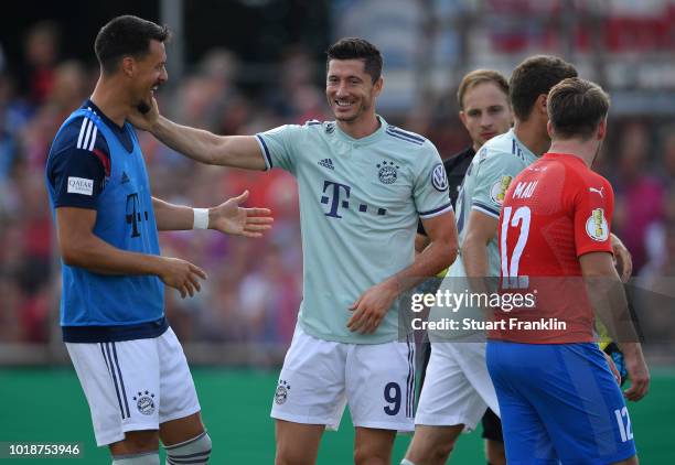 Robert Lewandowski of Muenchen celebrates scoring his goal with vduring the DFB Cup first round match between SV Drochtersen-Assel and Bayern...