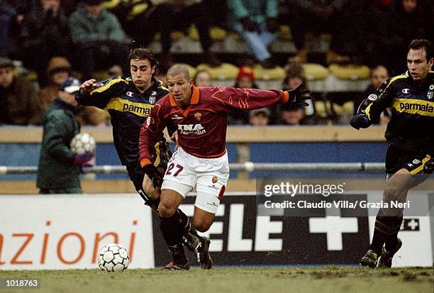 Fabio Junior of Roma is tackled by Fabio Cannavaro of Parma during the Italian Serie A match played at the Stadio Tardini in Turin, Italy. Parma won...