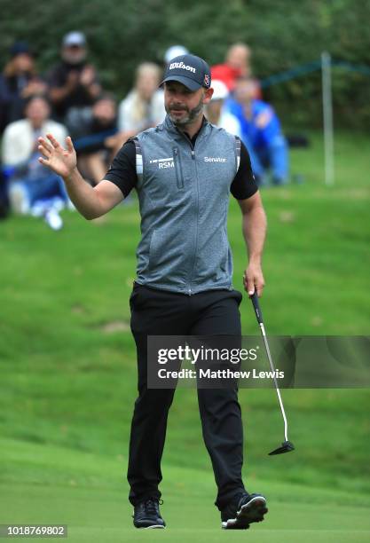 Paul Waring of England celebrates a birdie on the 17th green during day three of the Nordea Masters at Hills Golf Club on August 18, 2018 in...