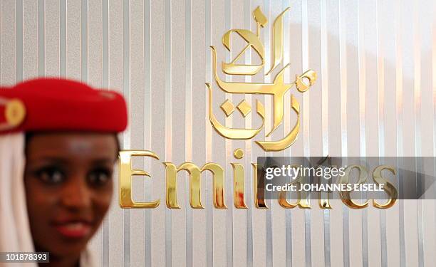 Stewardess poses inside of an Emirates Airlines A380 aircraft presented at the International Aerospace Exhibition on June 8, 2010 at the Schoenefeld...