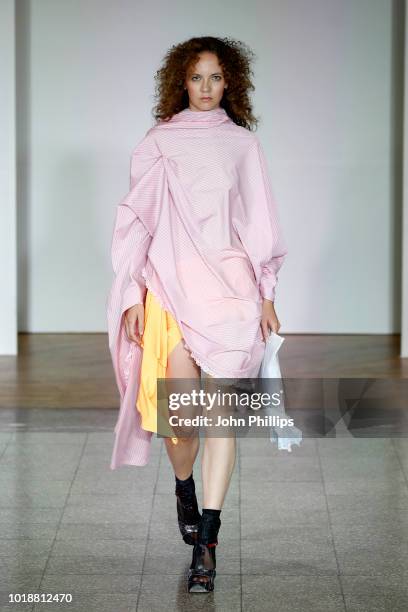 Model walks the runway at the Anne Karine Thorbjornsen show during Oslo Runway SS19 at Bankplassen 4 on August 14, 2018 in Oslo, Norway.