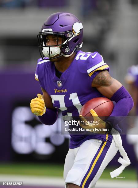 Mike Hughes of the Minnesota Vikings carries the ball as he warms up before the preseason game against the Jacksonville Jaguars on August 18, 2018 at...