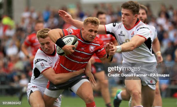 Gloucester's Ben Vellacott tackled by Ulster's Jonny Stewart and Angus Kernohan during the pre-season friendly match at the Kingspan Stadium, Belfast.