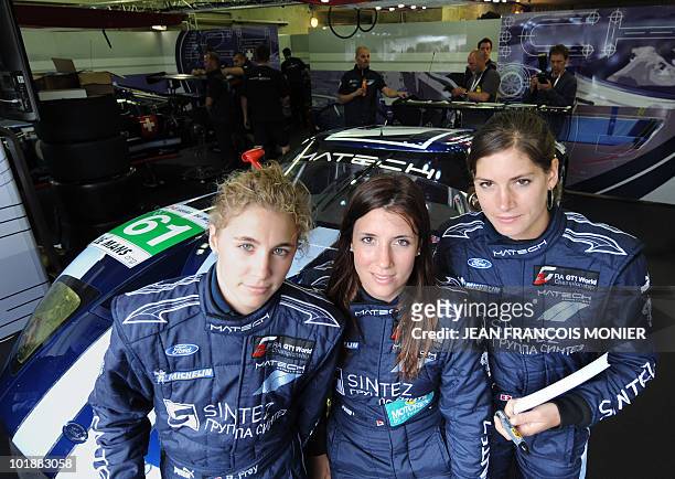 LtoR, Swiss Rahel Frey, Cyndie Allemann, and Natacha Gaghnang pose next their Ford GT on June 8, 2010 in Le Mans, western France. Fifty-six cars with...