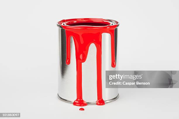 red paint dripping down a paint can - ペンキ缶 ストックフォトと画像