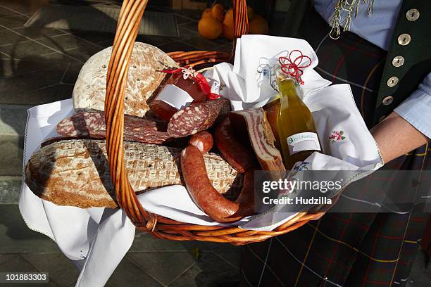 a woman holding a basket of sausages and bread, focus on basket, carinthia, austria - gourmet gift basket stock pictures, royalty-free photos & images