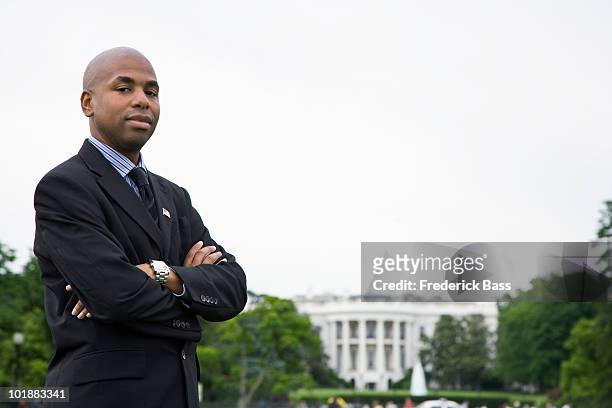 portrait of a man standing in front of the white house, washington dc, usa - white house in black and white stock pictures, royalty-free photos & images
