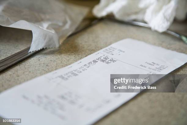 detail of a cafe receipt on a counter - restaurant bill stock pictures, royalty-free photos & images