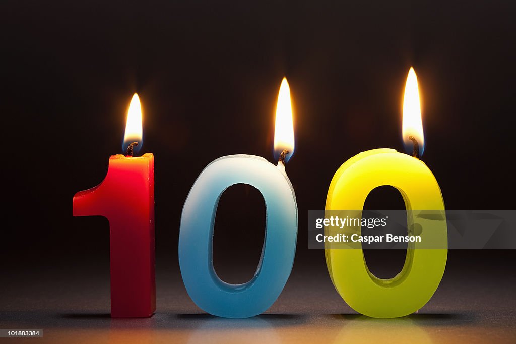 Three Candles In The Shape Of The Number 100