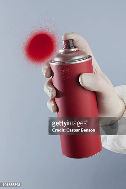 detail of a hand spray painting - red glove stock-fotos und bilder