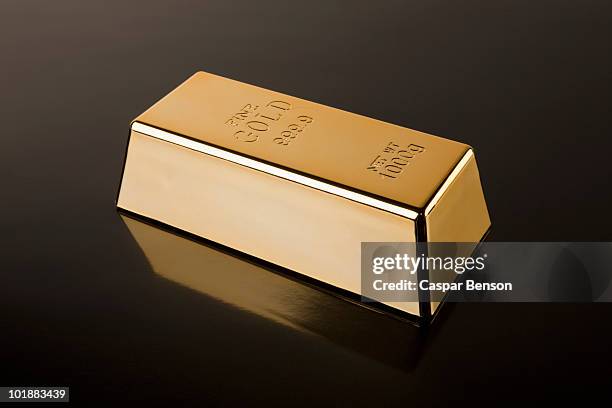 a gold bar - ingot stock-fotos und bilder