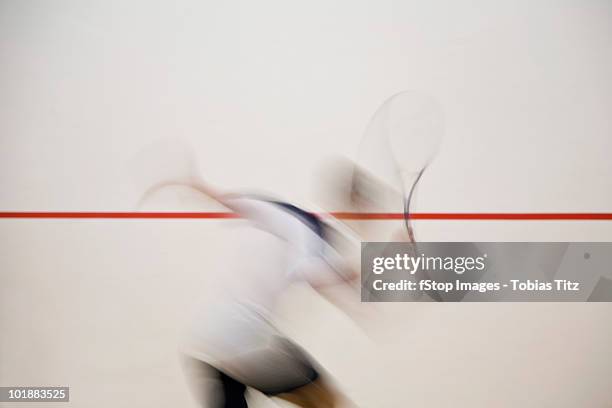 a man playing squash, blurred motion,  melbourne, victoria, australia - squash sport stock pictures, royalty-free photos & images