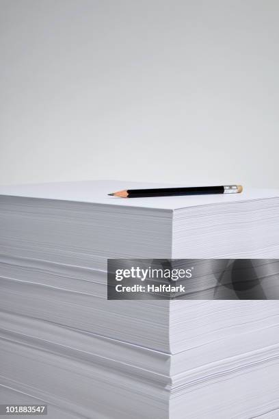 a pencil on a stack of paper - ream of paper stock pictures, royalty-free photos & images