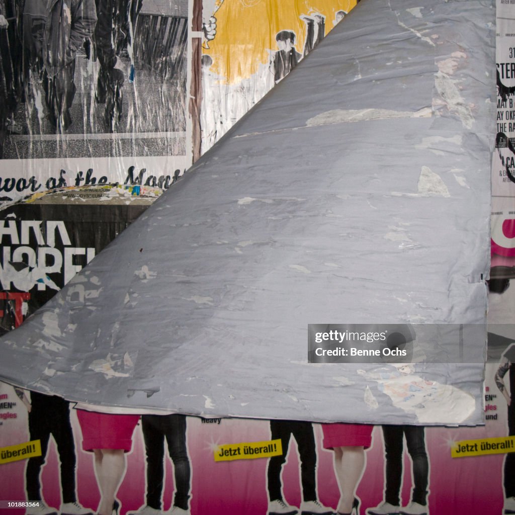 Detail of peeling posters on a wall