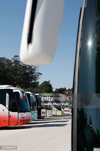coach buses parked in a row - coach bus stock pictures, royalty-free photos & images